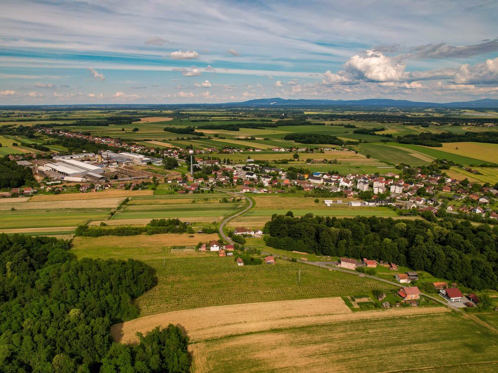 Aerial view of a rural town surrounded by farmland